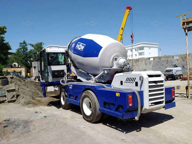 Self-loading concrete mixer truck
